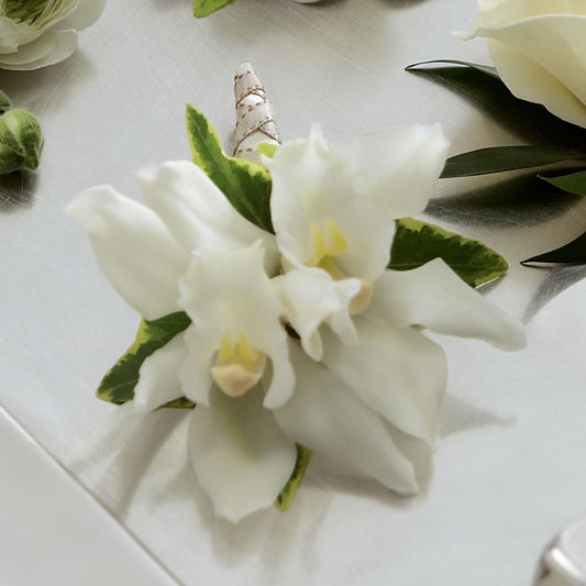 White Mini Cymbidium Boutonniere –  Margartia Flowers, Jersey City NJ